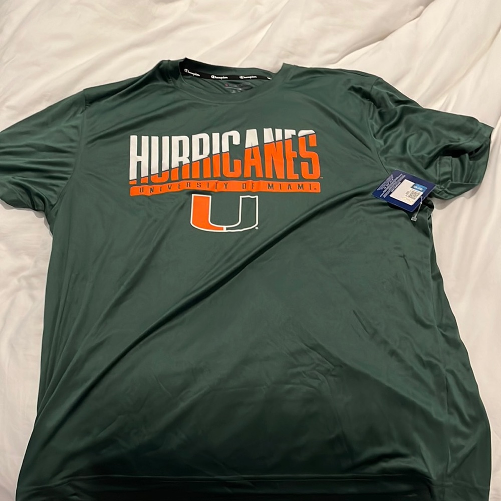 The brand is Champion. It is an extra large. The color is green - Picture 1 of 2